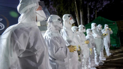 Workers at Tel HaShomer Hospital, which was converted to receive Israelis under quarantine on the cruise ship “Diamond Princess” in Japan due to the spread of the coronavirus, Feb. 20, 2020. Photo by Avshalom Sassoni/Flash90.