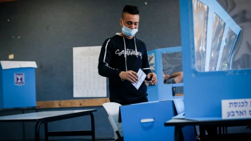 Arab Israelis cast their ballots as they vote in Israel's general election, in Kafr Manda in northern Israel, on March 23, 2021. Photo by Jamal Awad/Flash90.