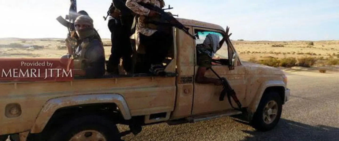 ISIS fighters brandish their weapons while riding a truck south of Rafah in the Gaza Strip. Credit: MEMRI.