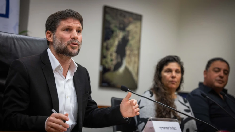 Israeli Finance Minister Bezalel Smotrich holds a press conference with bereaved families in the Ministry of Finance in Jerusalem, on Jan. 8, 2023. Photo by Yonatan Sindel/Flash90.
