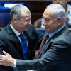 Knesset Speaker Yariv Levin, soon to be justice minister, and incoming Prime Minister Benjamin Netanyahu speak at the legislature in Jerusalem, Dec. 13, 2022. Photo by Yonatan Sindel/Flash90.