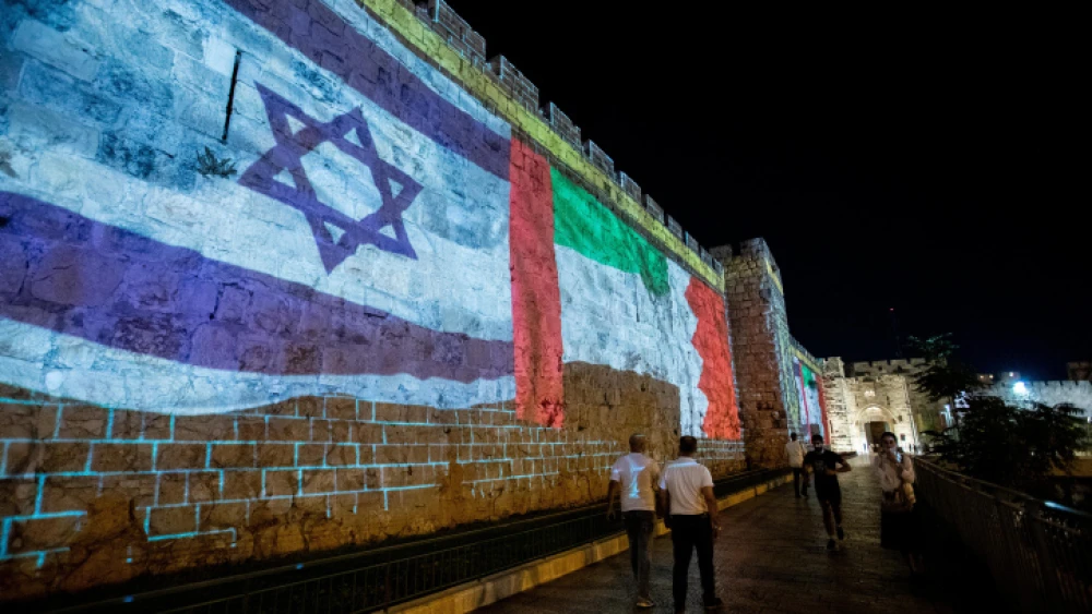 The flags of the United States, the United Arab Emirates, Israel and Bahrain are screened on the walls of Jerusalem's Old City, on Sept. 15, 2020. Photo by Yonatan Sindel/Flash90.