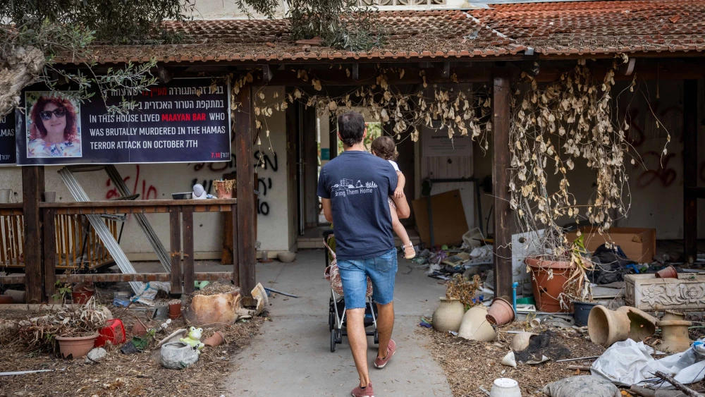 Family members and friends visit Kibbutz Be'eri, a year after the Hamas massacre there, on Oct. 7, 2024. Photo by Yonatan Sindel/Flash90.