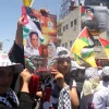 Palestinians hold posters showing Dalal Mughrabi, a terrorist involved in an infamous 1978 attack in which 35 Israelis were killed. Photo by Issam Rimawi/Flash 90.