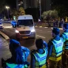 People and Israeli security forces pay their respects as the convoy carrying the bodies of hostages arrive at the Abu Kabir Forensic Institute in Tel Aviv, on Oct. 16, 2025. Photo by Yonatan Sindel/Flash90.