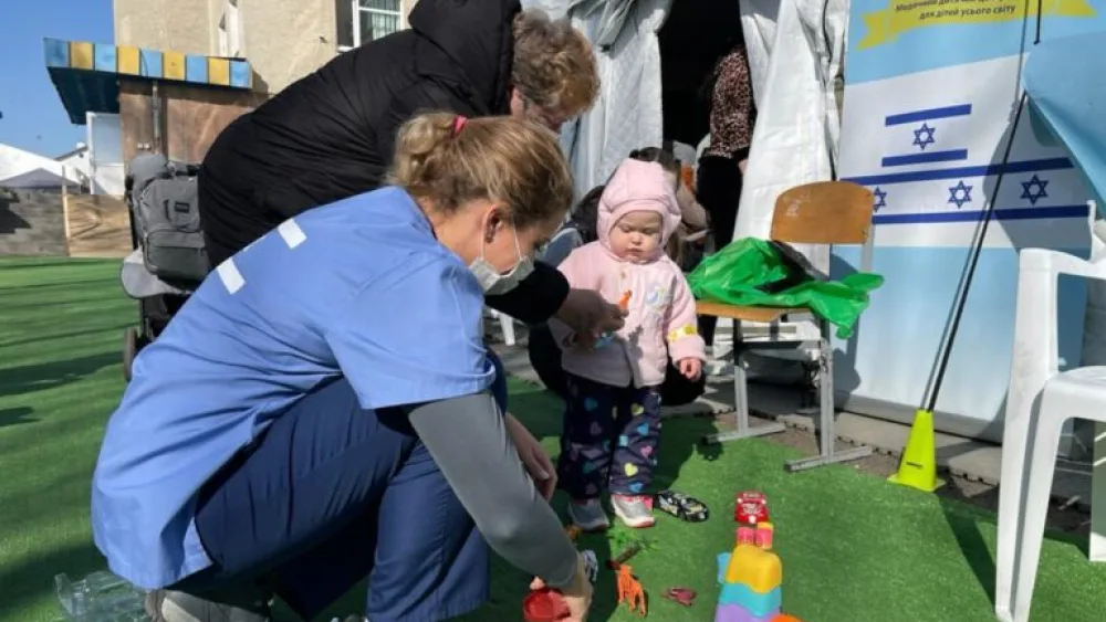 Israeli medical personnel with a young Ukrainian patient. Photo by Naama Frank Azriel.