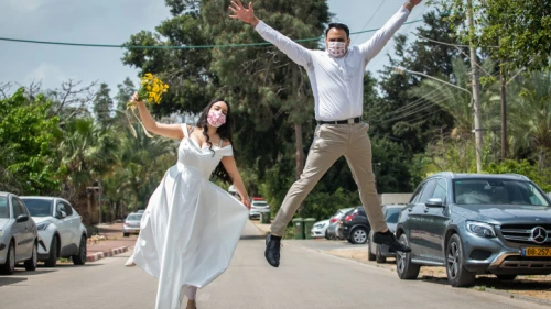 An Israeli couple poses for a picture before their wedding in Moshav Yashresh on April 6, 2020. Photo by Yossi Aloni/Flash90.