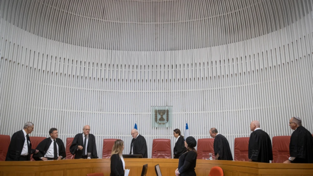 Israeli Supreme Court justices and Supreme Court president Esther Hayut arrive in the courtroom in Jerusalem. Photo by Yonatan Sindel/Flash90.