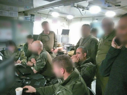 Former OC 162nd Division, Maj. Gen. Itzik Cohen, and the former commander of the Shayetet 13 naval commando unit, Col A., look on from the Command Center overseeing the operation to recover Staff Sgt. Oron Shaul’s body. Credit: IDF.