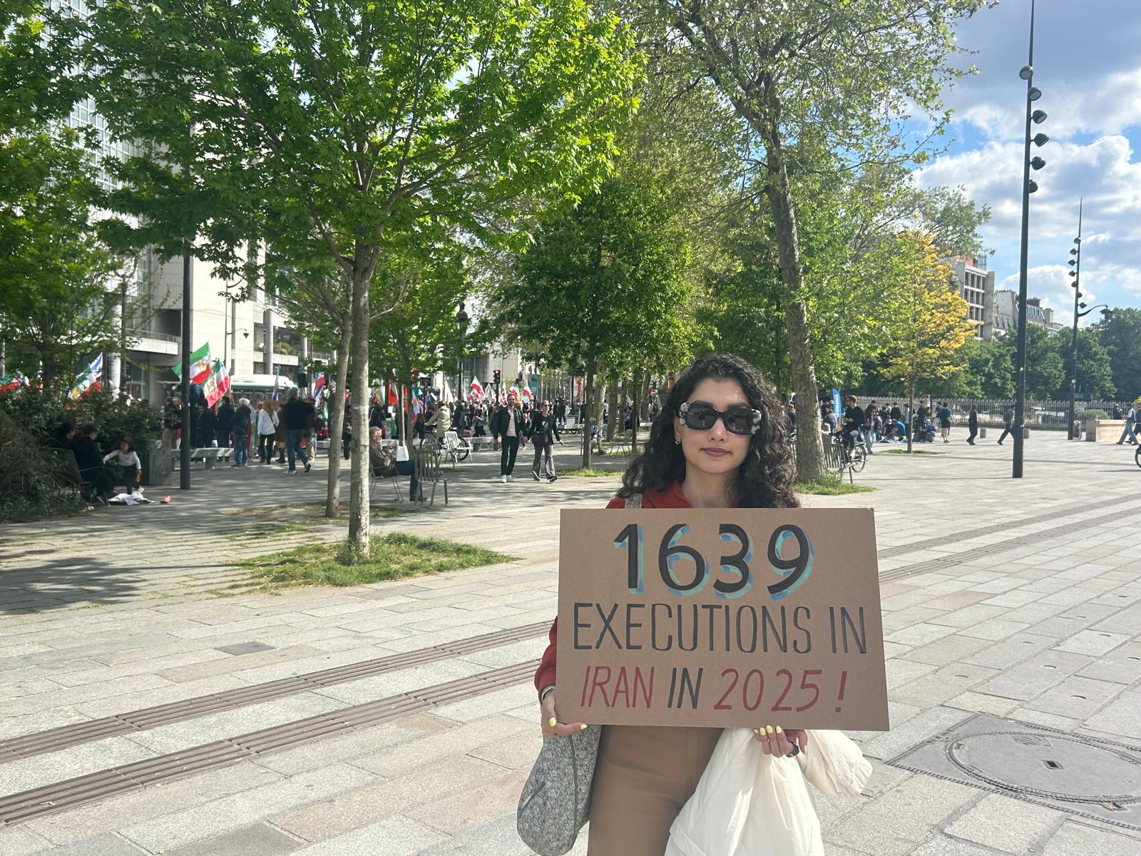 Mahsa Mirza Zad Ziabary at the demonstration in Place de la Bastille, Paris, April 19, 2026. Photo by Amelie Botbol.