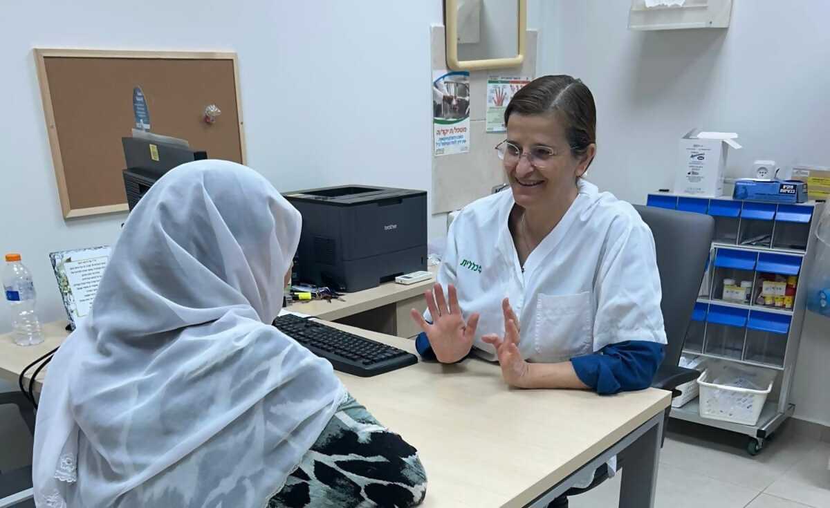 Dr. Nadia Khir with a patient at a Clalit Health Services clinic in the Druze-Israeli town of Julis. Credit: Courtesy.
